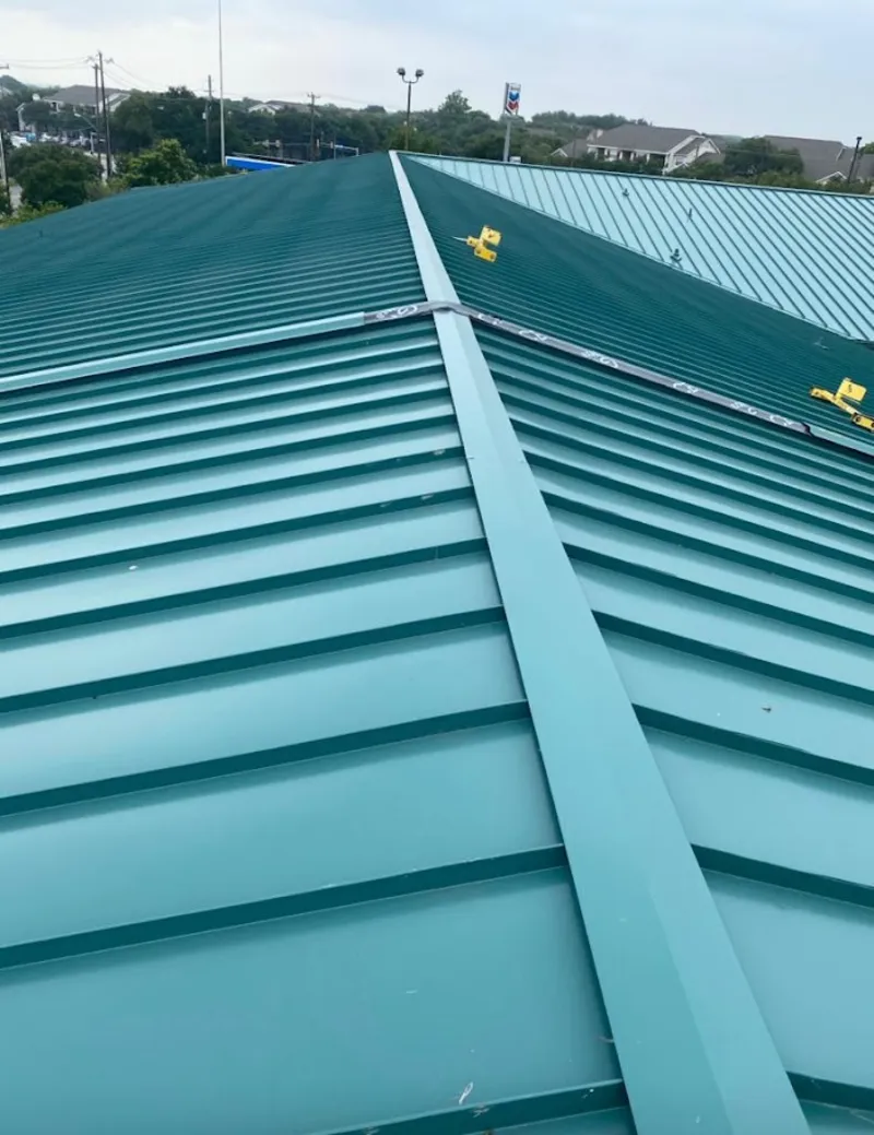 Green commercial metal roof ridge and valley for Metal Roof Repair in Owosso